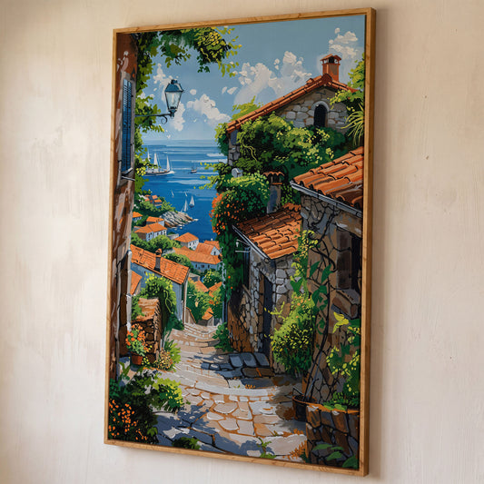 Coastal Village Canvas Art, Sailboats and Stone Streets shown in white oak floating frame