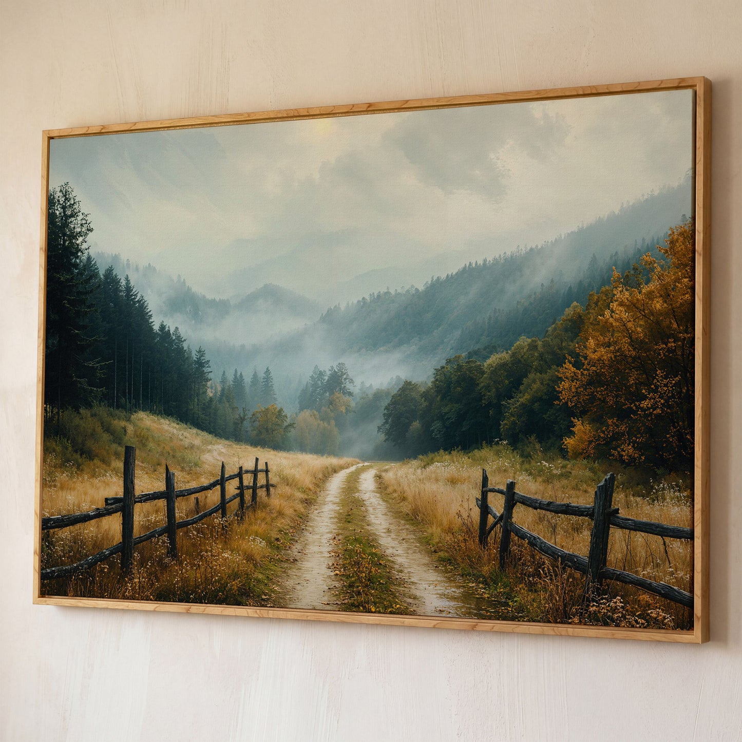 Misty Mountain Road with Weathered Fence Canvas Print shown in white oak floating frame