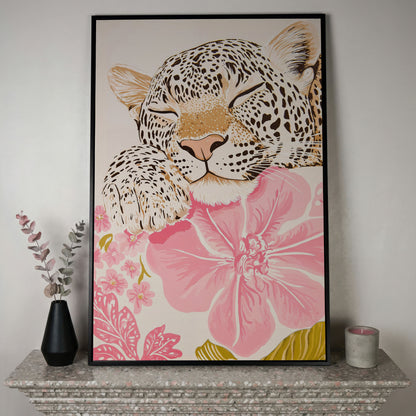 Leopard Resting on Pink Flowers Canvas in black floating frame
