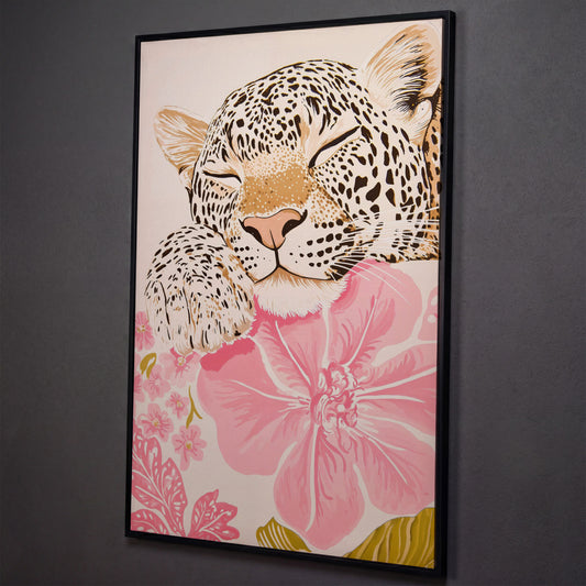 Leopard Resting on Pink Flowers Canvas shown in black floating frame