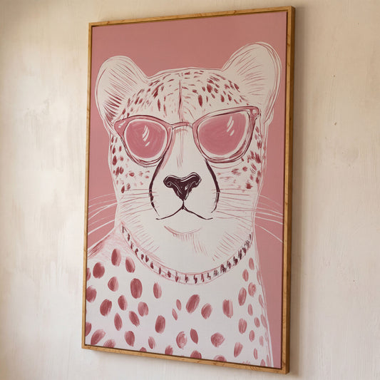Cheetah in Pink Sunglasses Canvas shown in white oak floating frame