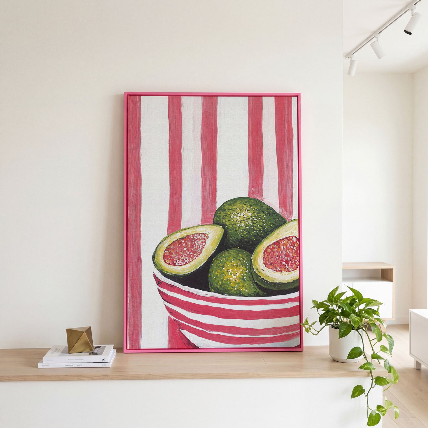 Avocado Still Life with Striped Bowl Canvas Print in pink floating frame