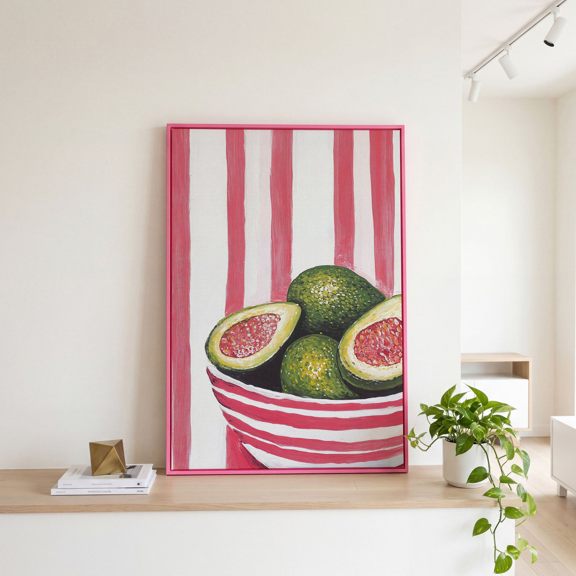 Avocado Still Life with Striped Bowl Canvas Print in pink floating frame