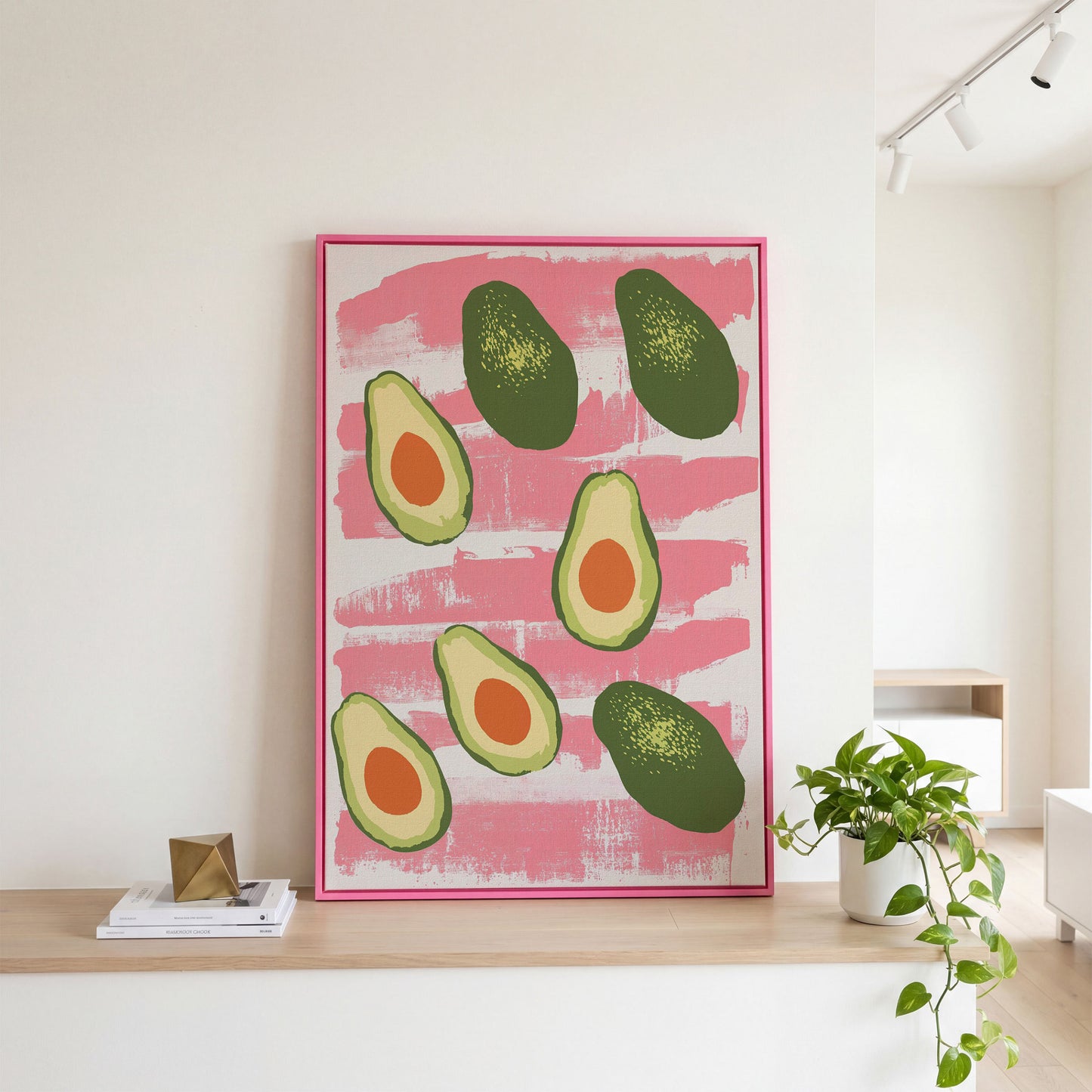 Scattered Avocados Canvas. Pink and Green Modern Print in pink floating frame