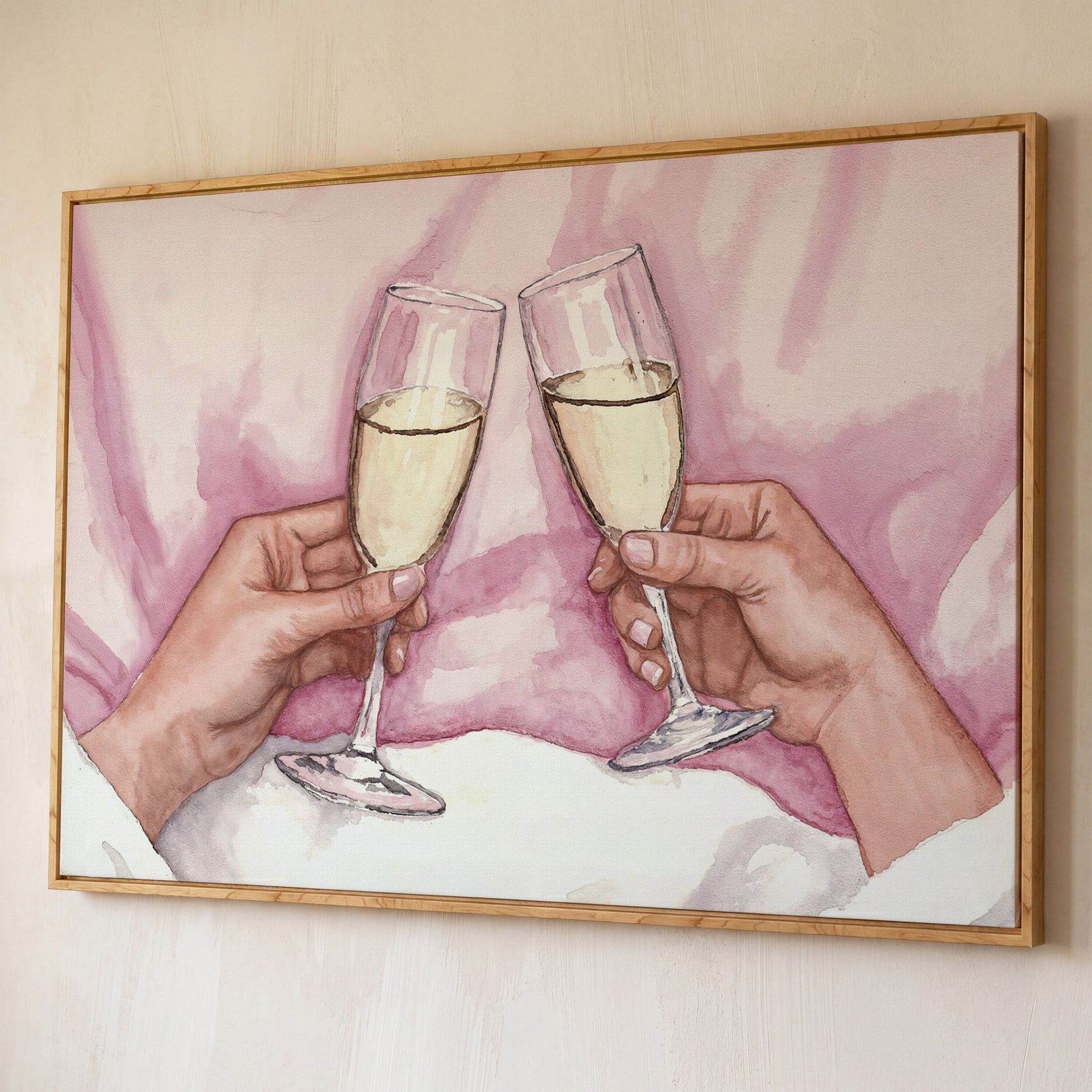 Champagne Toast Canvas Art in Rose Quartz and Gold shown in white oak floating frame