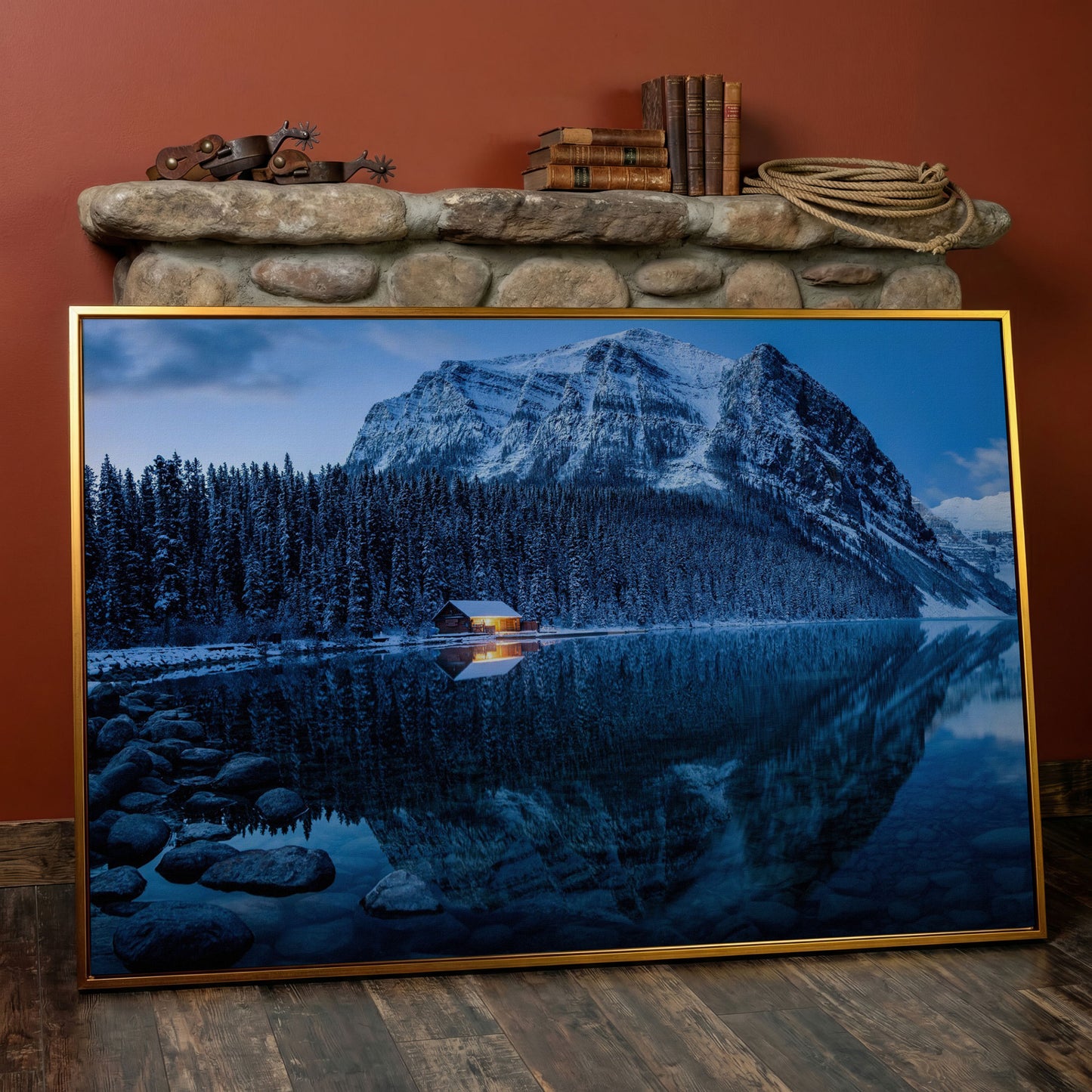 Lake Louise Winter Canvas with Lit Cabin and Mountain Reflection in antique gold floating frame