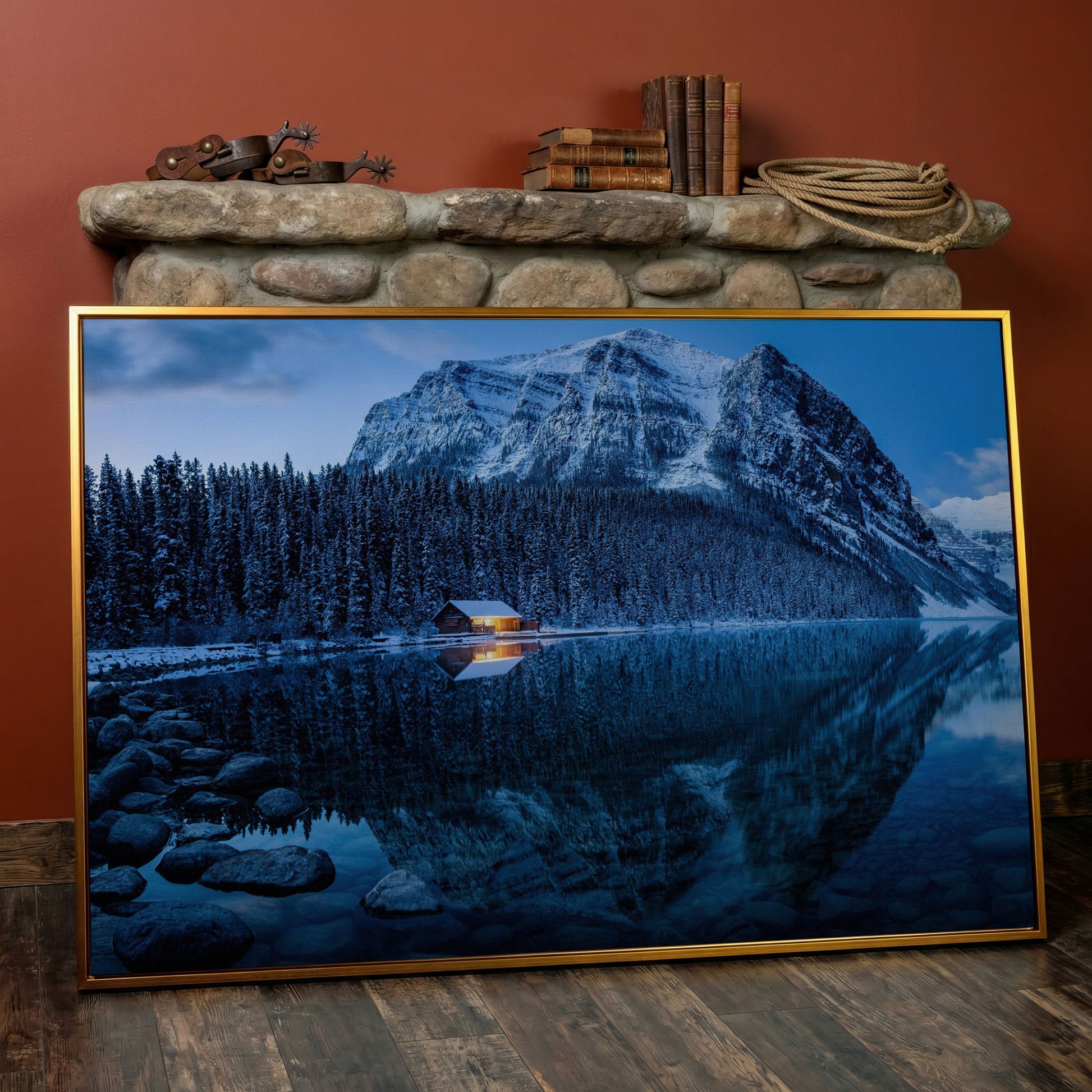 Lake Louise Winter Canvas with Lit Cabin and Mountain Reflection in antique gold floating frame