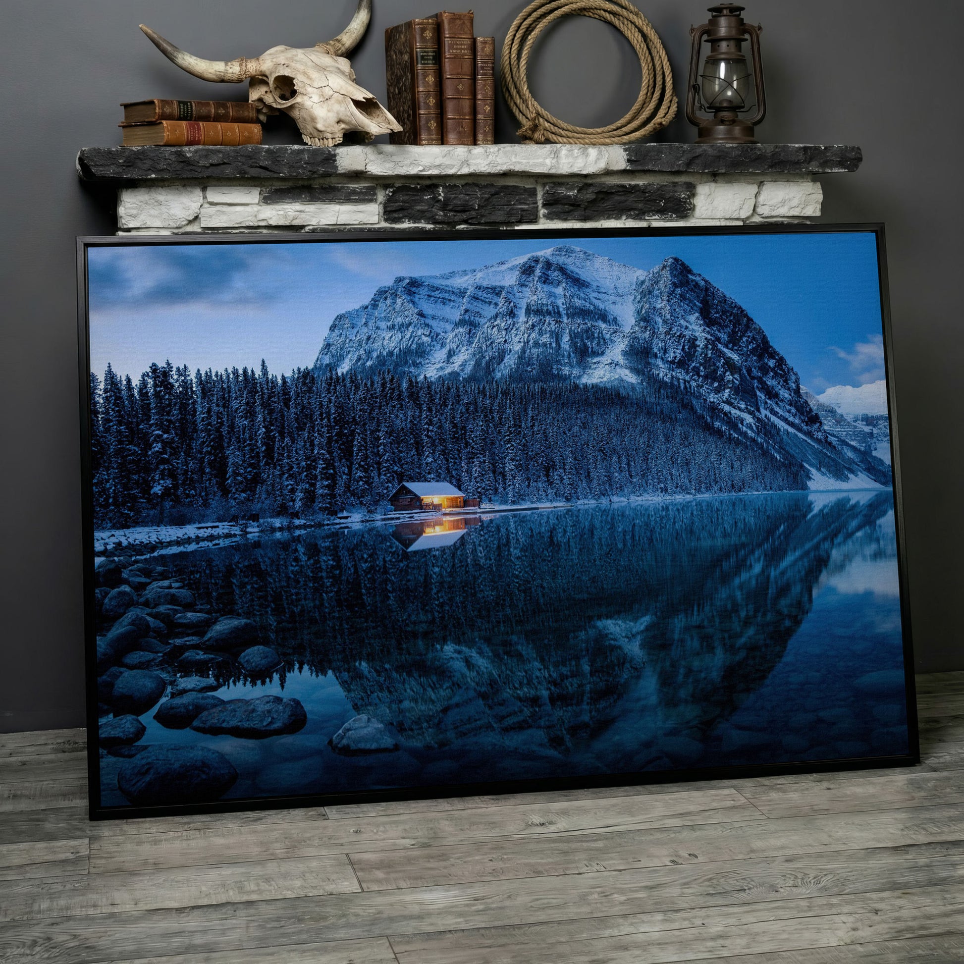 Lake Louise Winter Canvas with Lit Cabin and Mountain Reflection in black floating frame