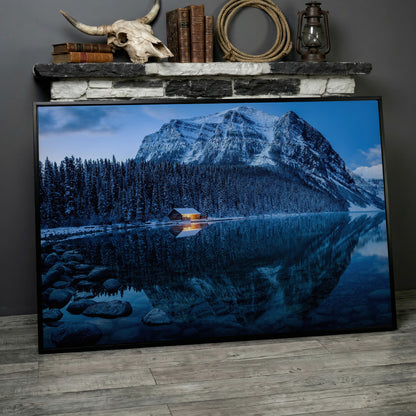 Lake Louise Winter Canvas with Lit Cabin and Mountain Reflection in black floating frame