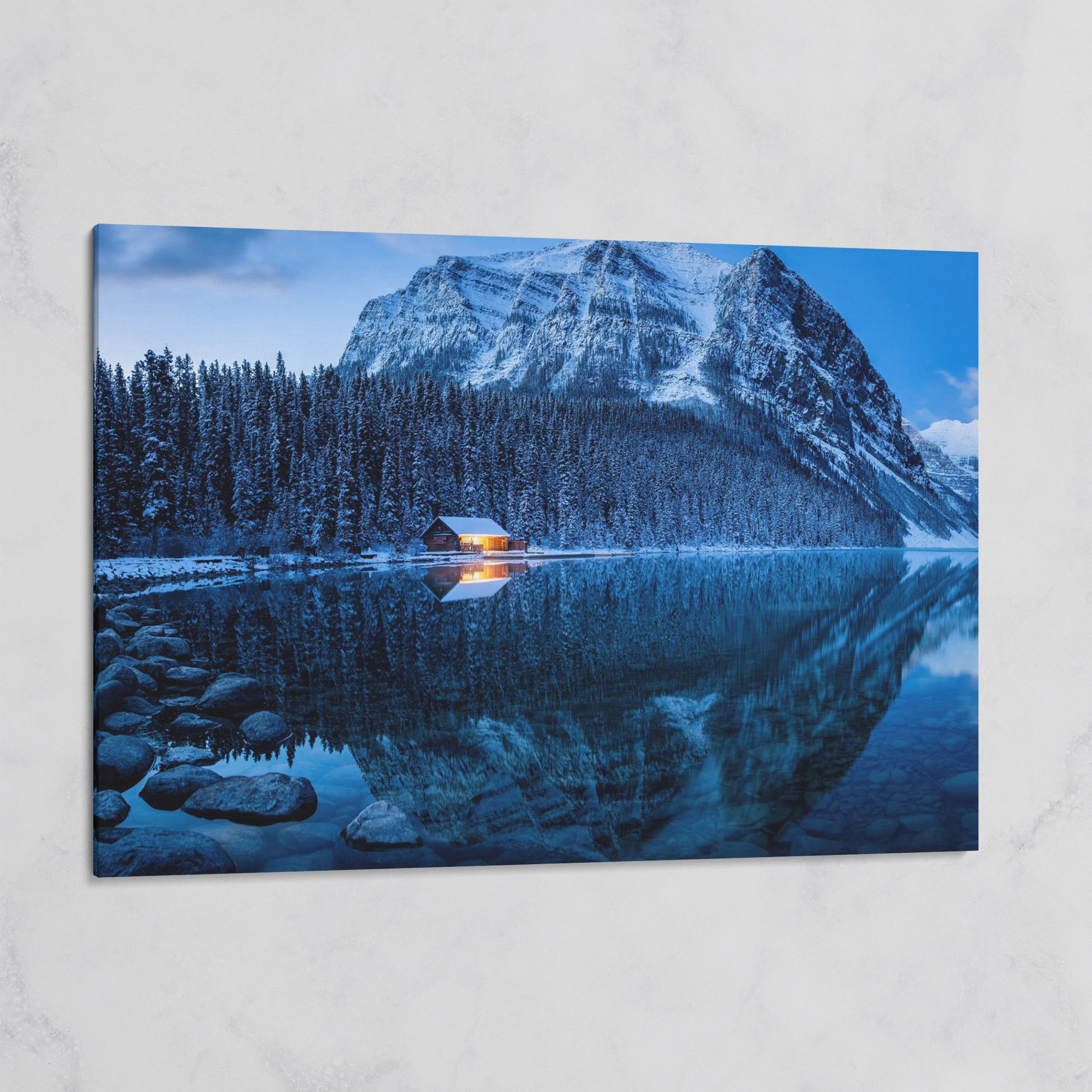 Lake Louise Winter Canvas with Lit Cabin and Mountain Reflection on gallery wrap