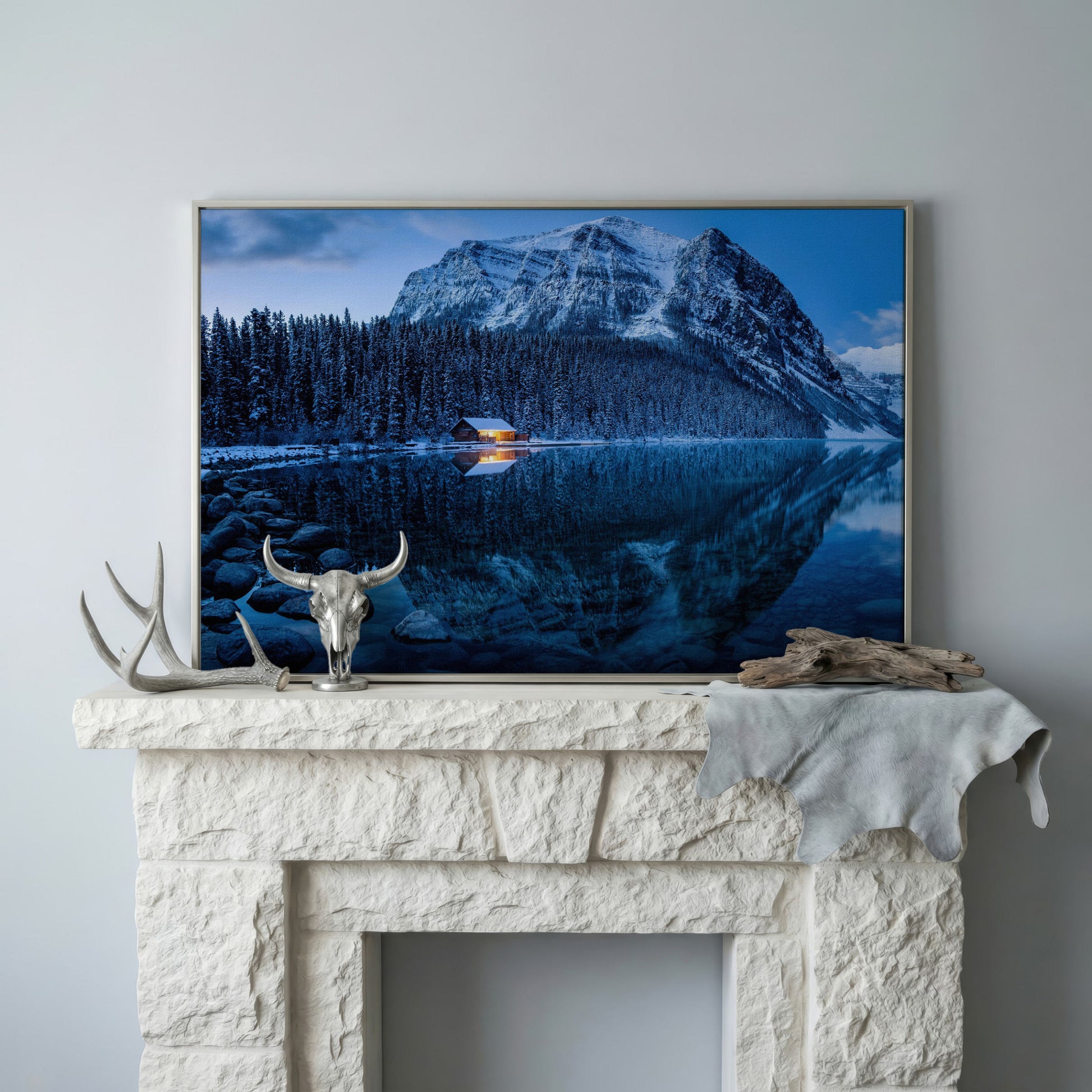 Lake Louise Winter Canvas with Lit Cabin and Mountain Reflection in silver floating frame