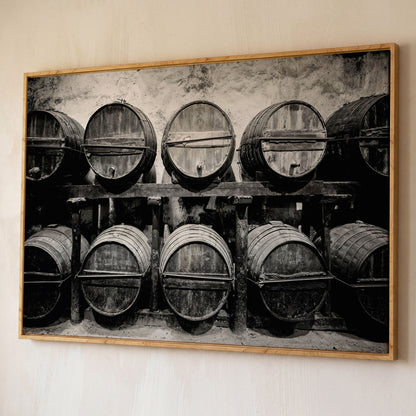 Wine Barrels in the Winery Canvas Print shown in white oak floating frame
