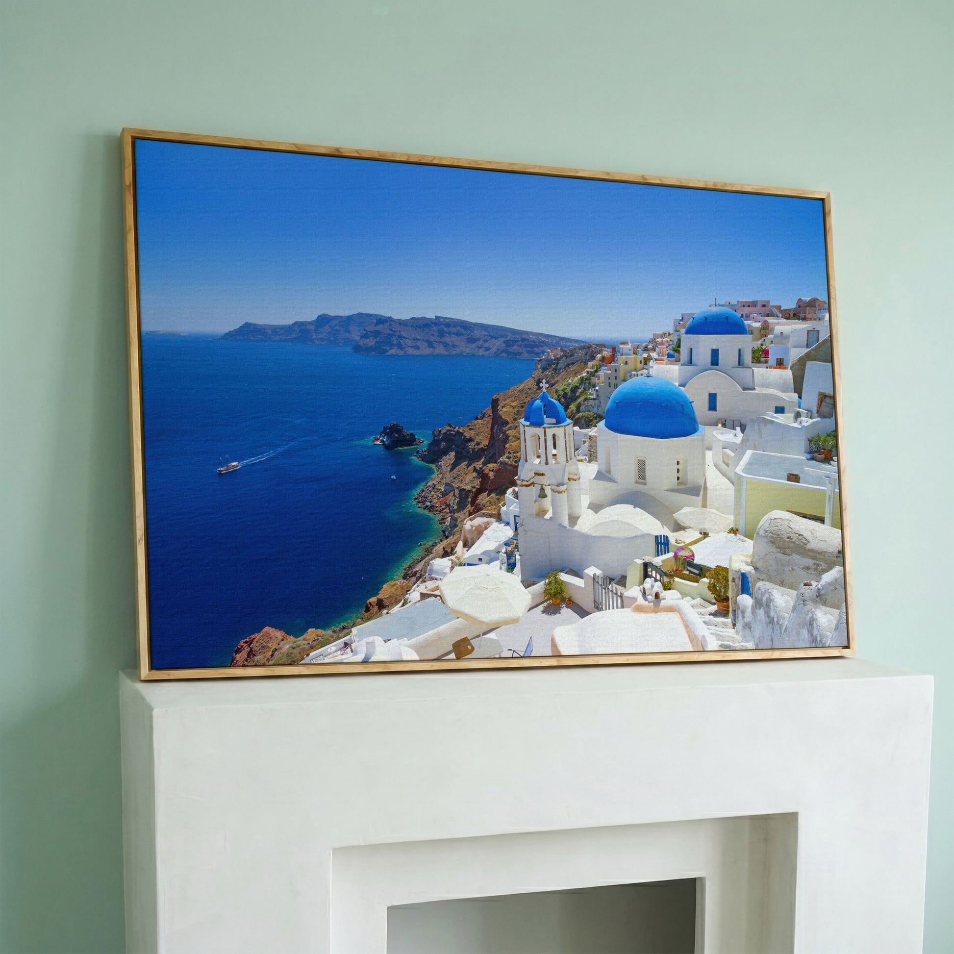 Santorini Island Canvas Print with Blue Domes in white oak floating frame