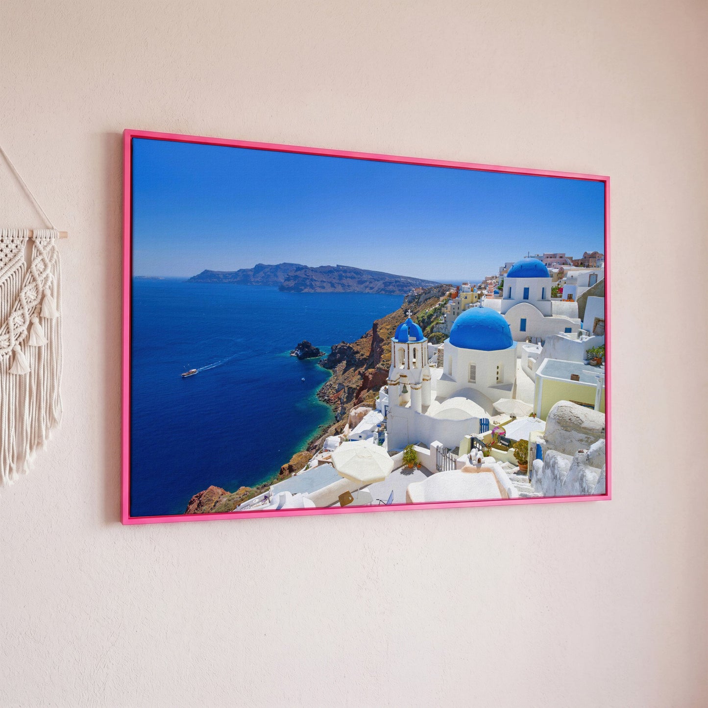 Santorini Island Canvas Print with Blue Domes in pink floating frame