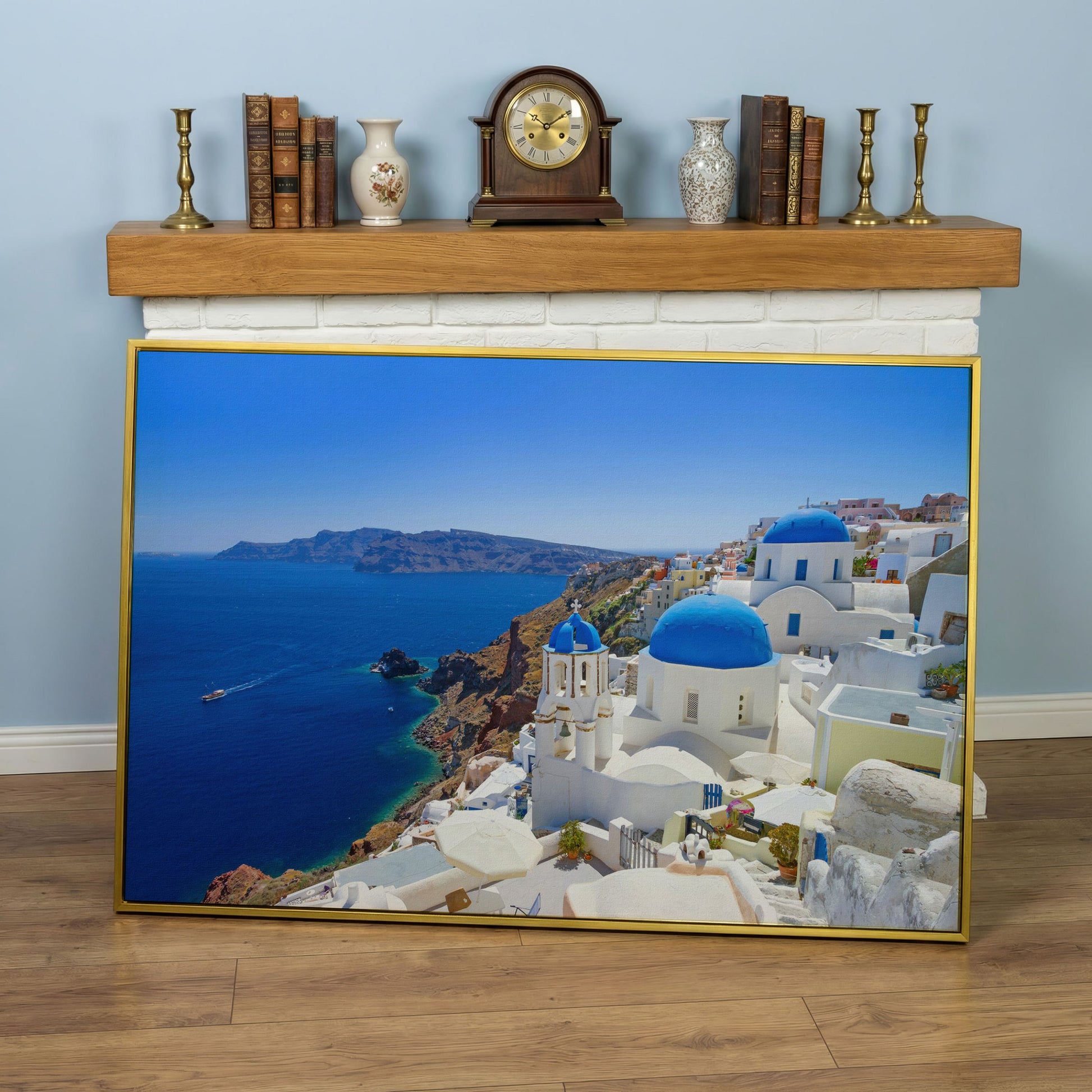 Santorini Island Canvas Print with Blue Domes in yellow gold floating frame