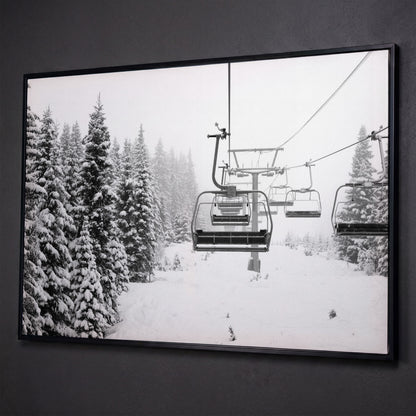 Ski Lift in Snow Canvas Print, Black and White shown in black floating frame