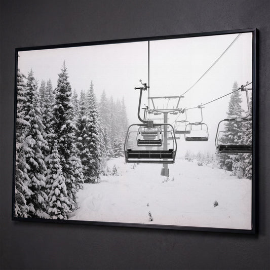 Ski Lift in Snow Canvas Print, Black and White shown in black floating frame