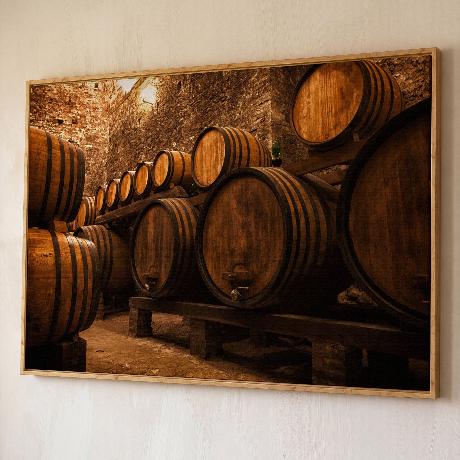 Wine Cellar with Oak Barrels Canvas Art shown in white oak floating frame