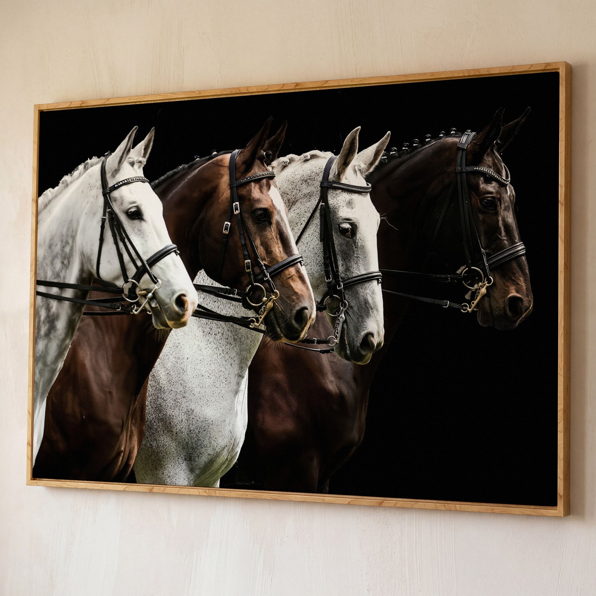 Four Horses in Sepia Canvas Print shown in white oak floating frame