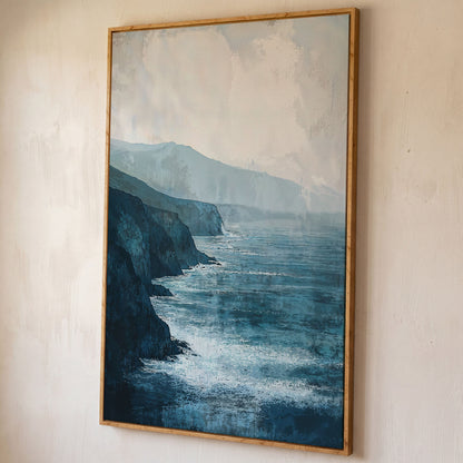 Stormy Coastal Cliffs Seascape Canvas Wall Art shown in white oak floating frame