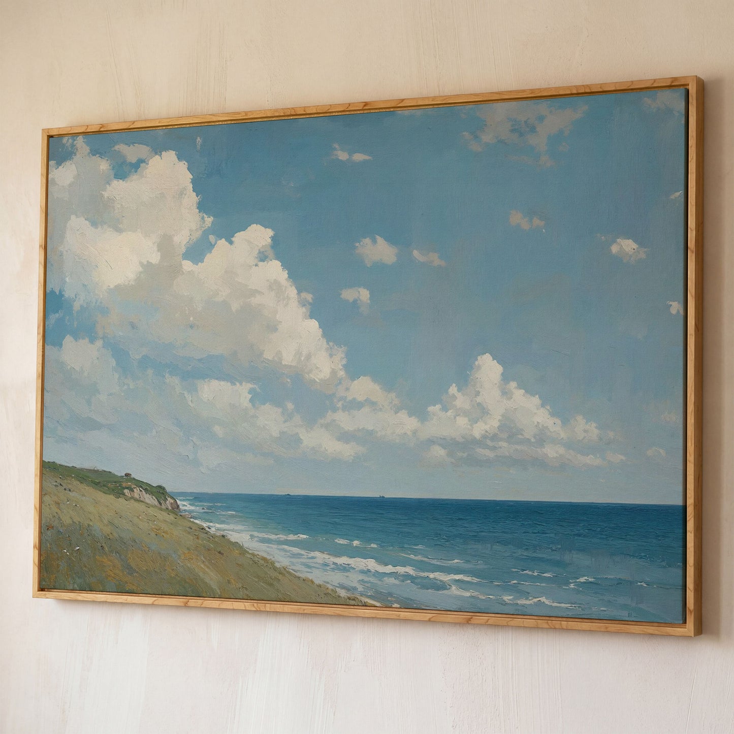 Serene Coastal Cliff Seascape Canvas shown in white oak floating frame