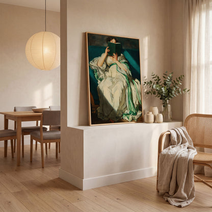 Woman Reading on a Turquoise Sofa. Canvas Wall Art for Book Lovers in white oak floating frame