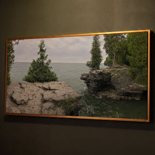 Cave Point Park Panoramic Canvas shown in antique gold floating frame