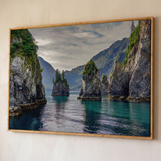 Turquoise Water and Rock Spires Panoramic Canvas shown in white oak floating frame