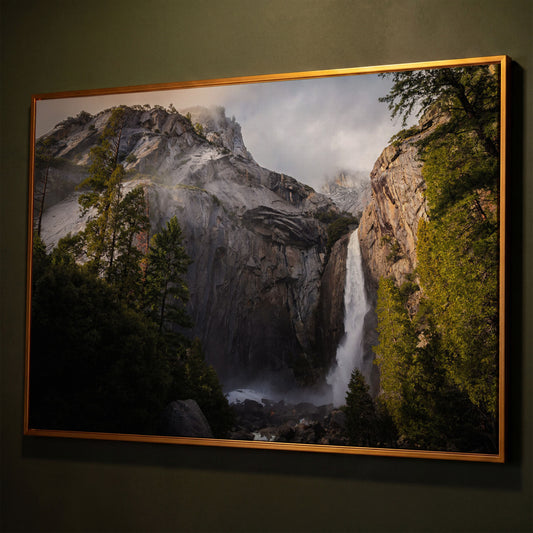 Winter Storm at Yosemite Falls Panoramic Canvas shown in antique gold floating frame