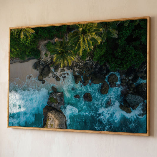 Indian Ocean Rocky Beach Panoramic Canvas shown in white oak floating frame