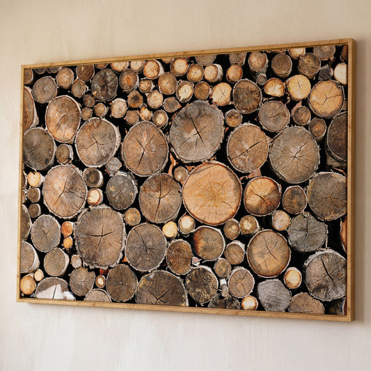 Stacked Firewood Canvas Wall Art shown in white oak floating frame
