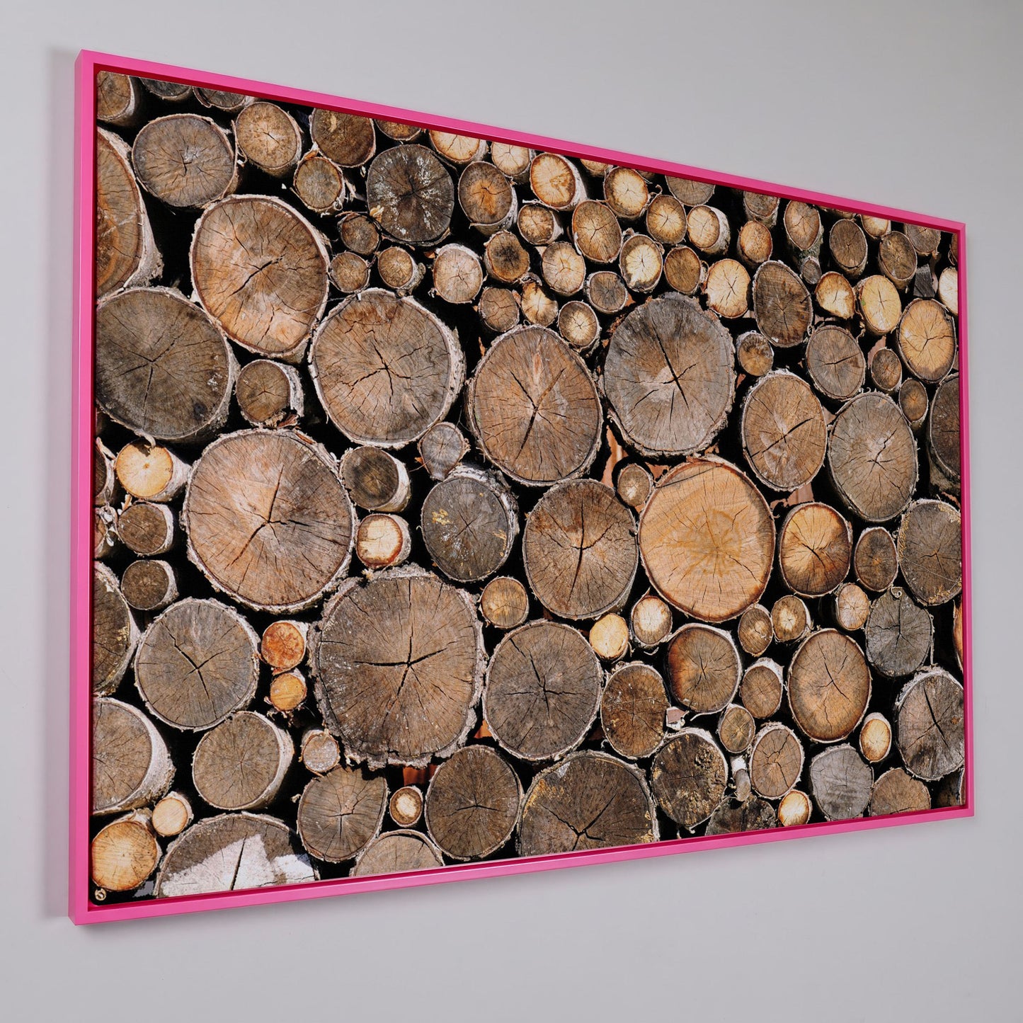 Stacked Firewood Canvas Wall Art in pink floating frame