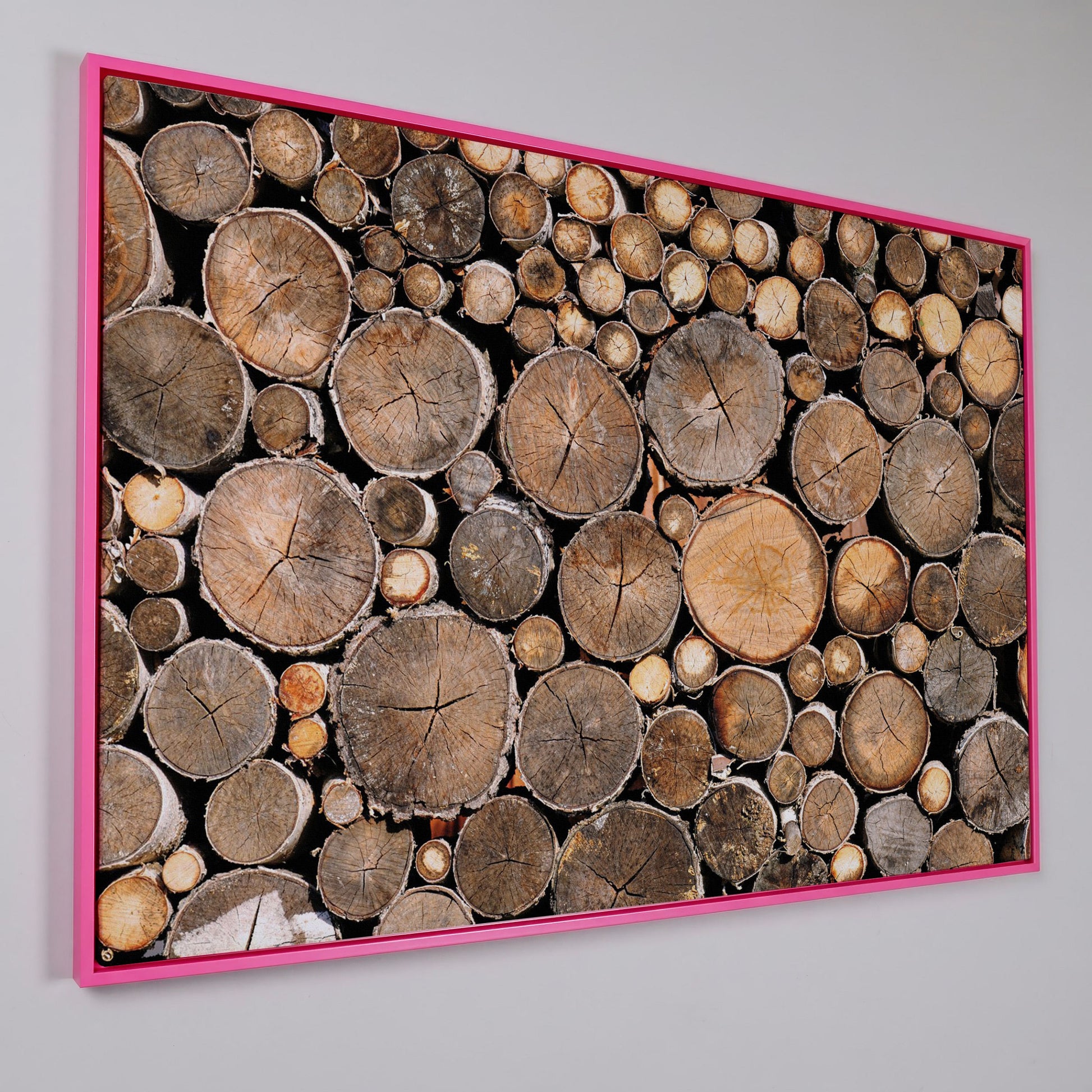Stacked Firewood Canvas Wall Art in pink floating frame