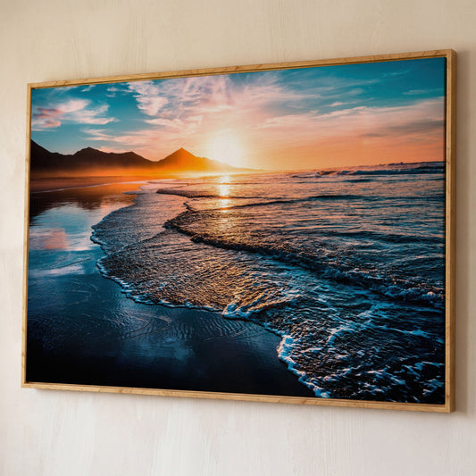 Tranquil Ocean Waves at Sunset Canvas shown in white oak floating frame