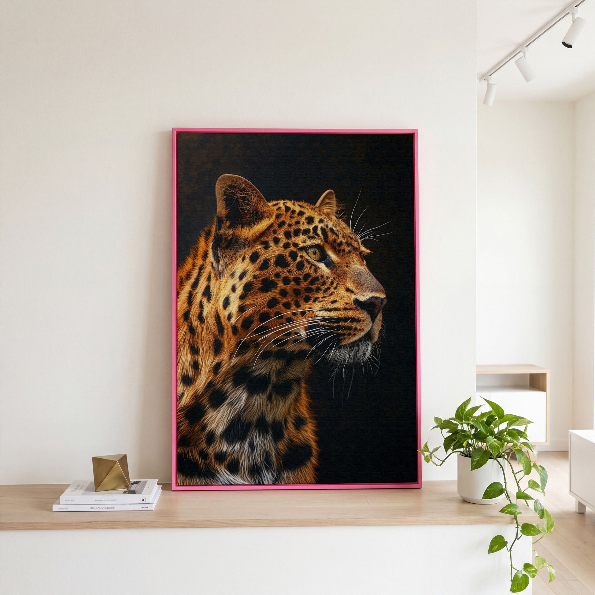 Leopard's Intense Gaze Canvas Print in pink floating frame