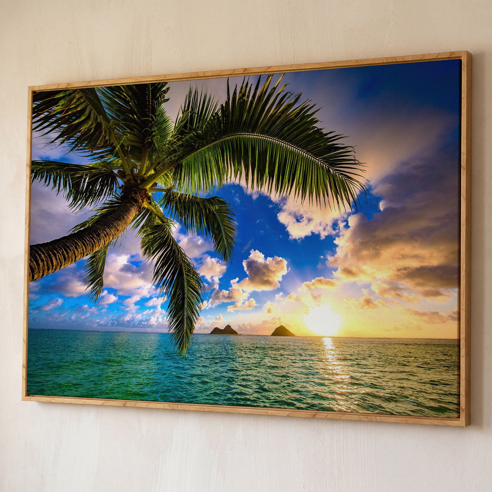 Tropical Island Sunrise Over Water Canvas shown in white oak floating frame