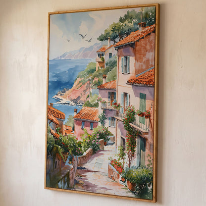 Mediterranean Seaside Village Canvas Print shown in white oak floating frame