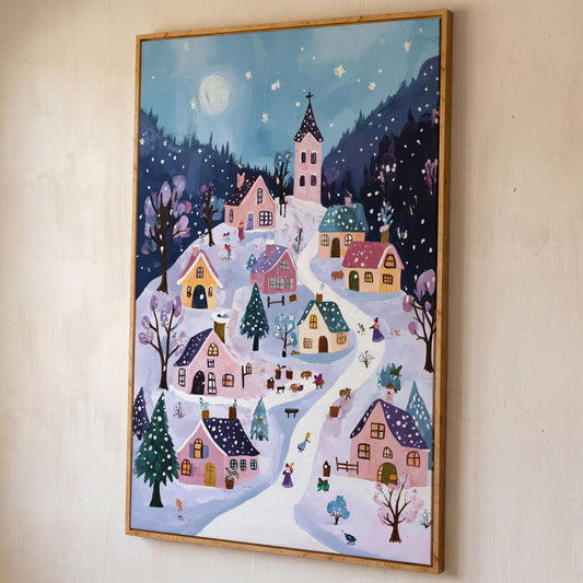 Snowy Winter Village Canvas Print shown in white oak floating frame