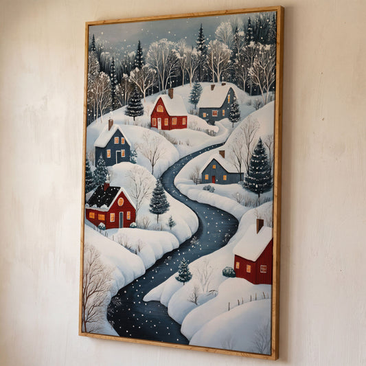 Cozy Winter Village Scene Canvas Print shown in white oak floating frame