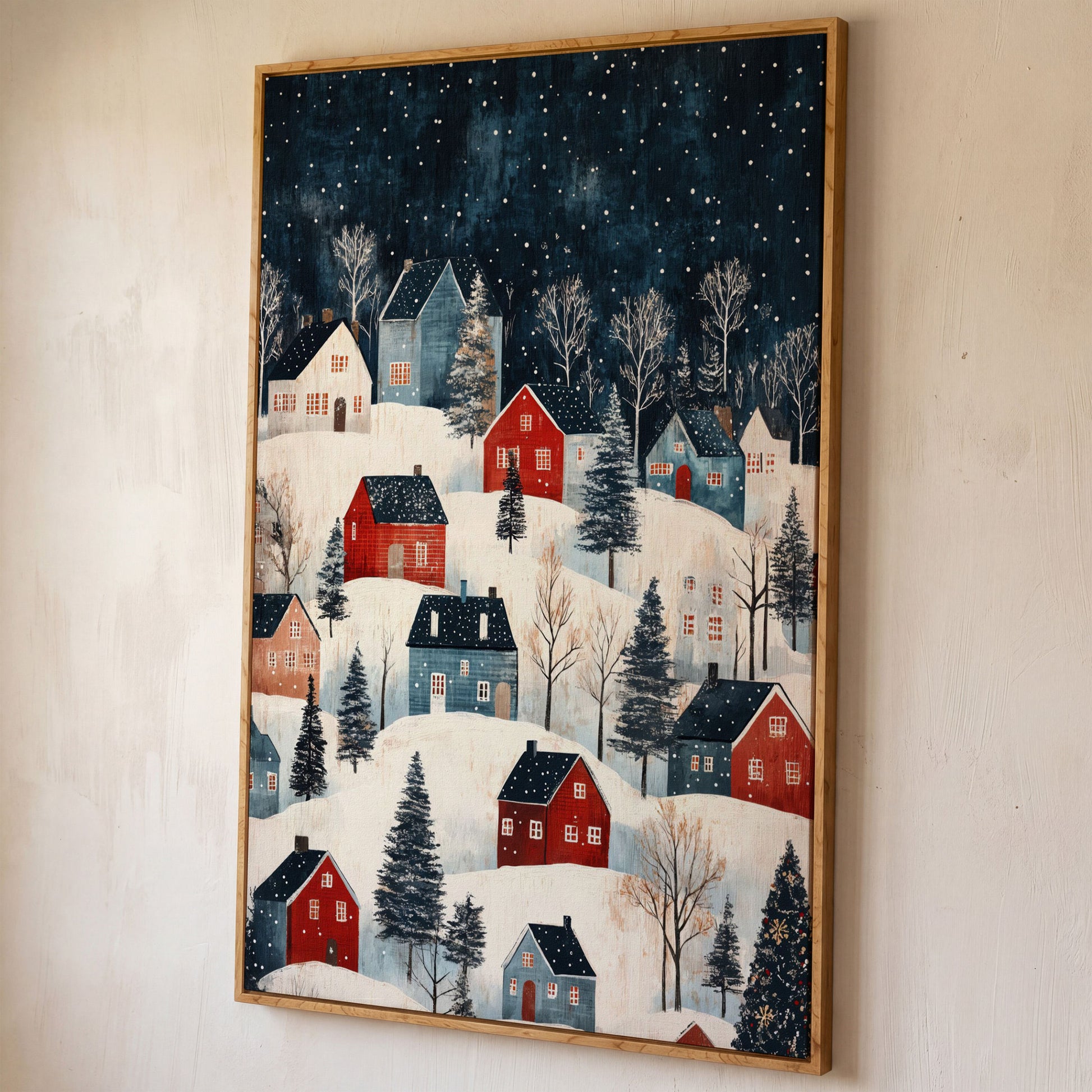 Snowy Village on Rolling Hills Canvas Print shown in white oak floating frame