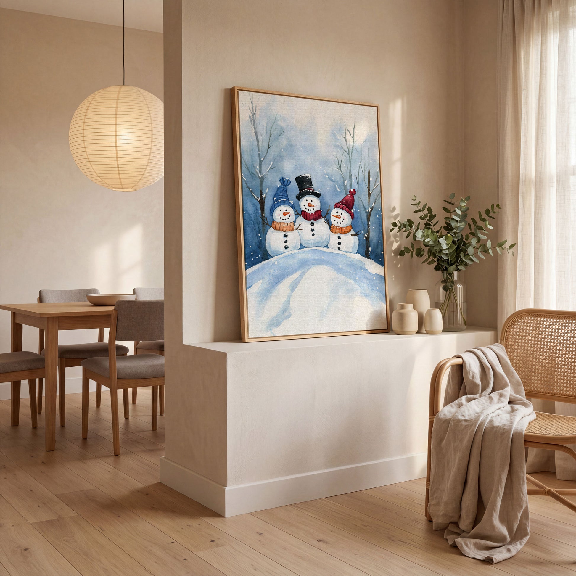 Three Snowmen on a Hill Canvas Print in white oak floating frame