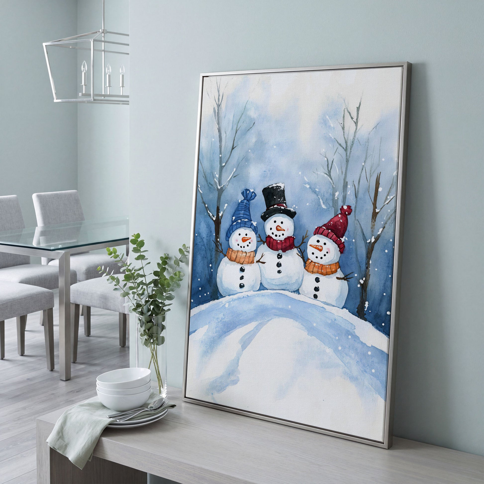 Three Snowmen on a Hill Canvas Print in silver floating frame