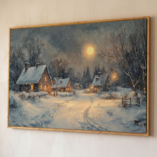 Snowy Winter Village by Moonlight Canvas shown in white oak floating frame