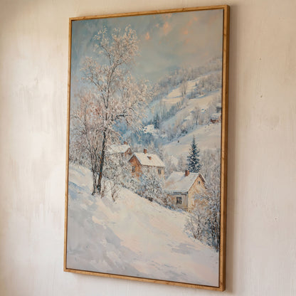 Snowy Village and Mountain Landscape Canvas shown in white oak floating frame