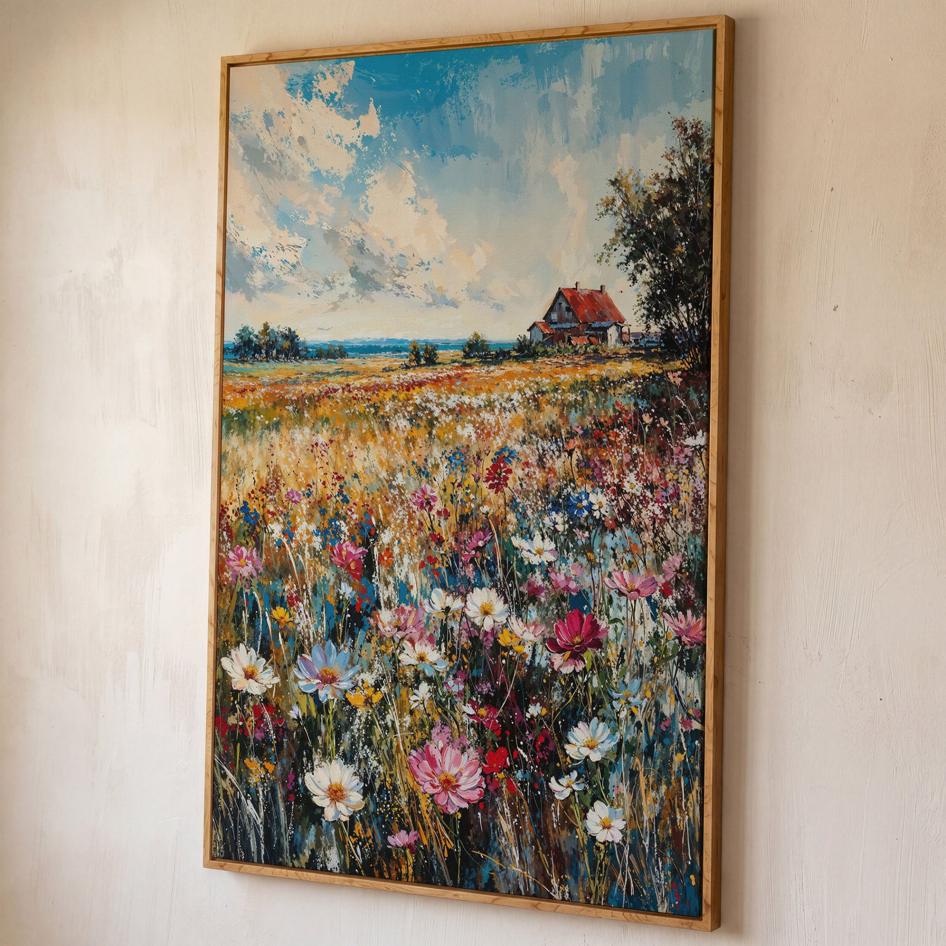 Cottage in Meadow with Wildflowers Canvas Print shown in white oak floating frame