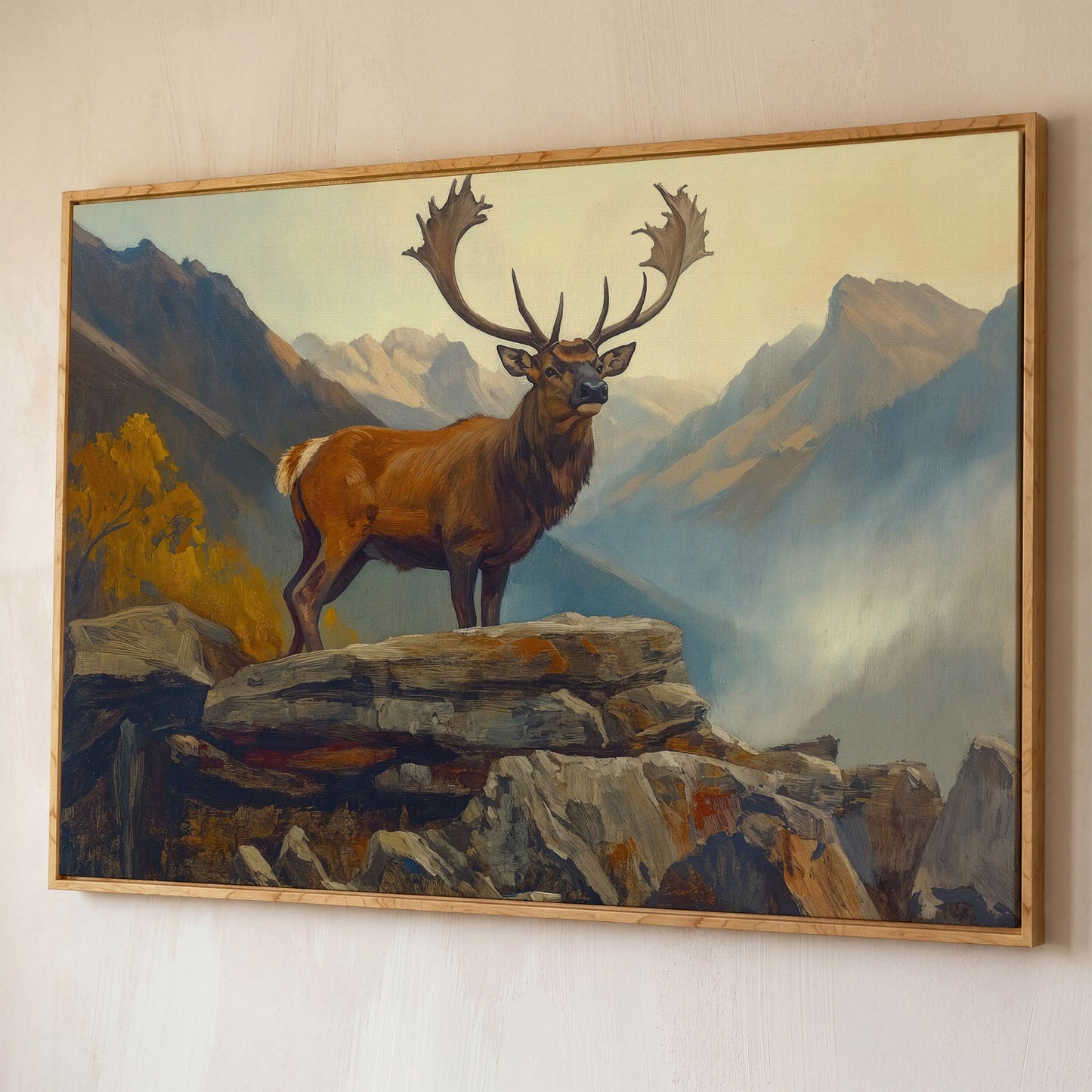 Bull Elk on Rocky Ridge, Misty Mountain Canvas Wall Art shown in white oak floating frame