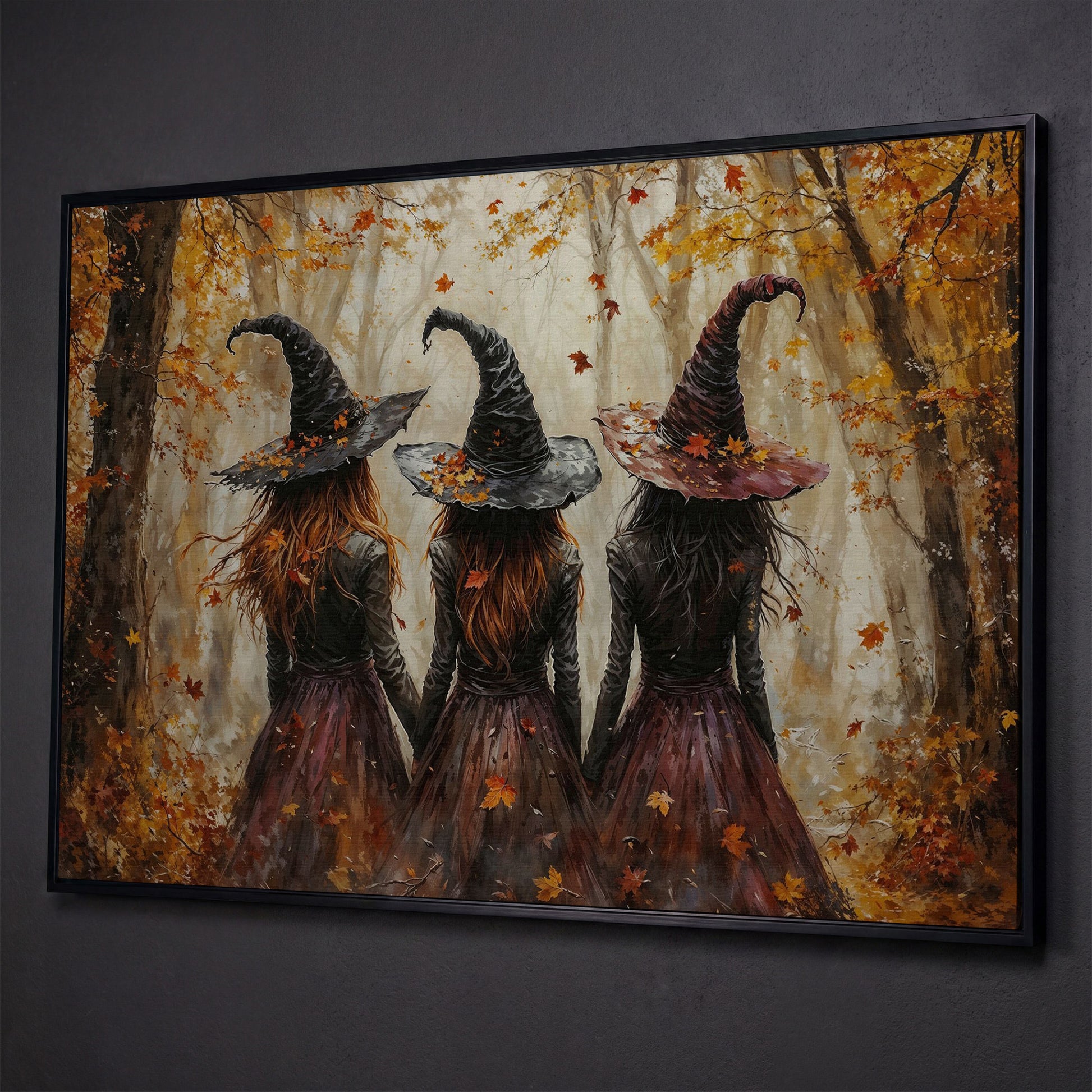 Three Witches Walking Through a Fall Forest Canvas Wall Art shown in black floating frame