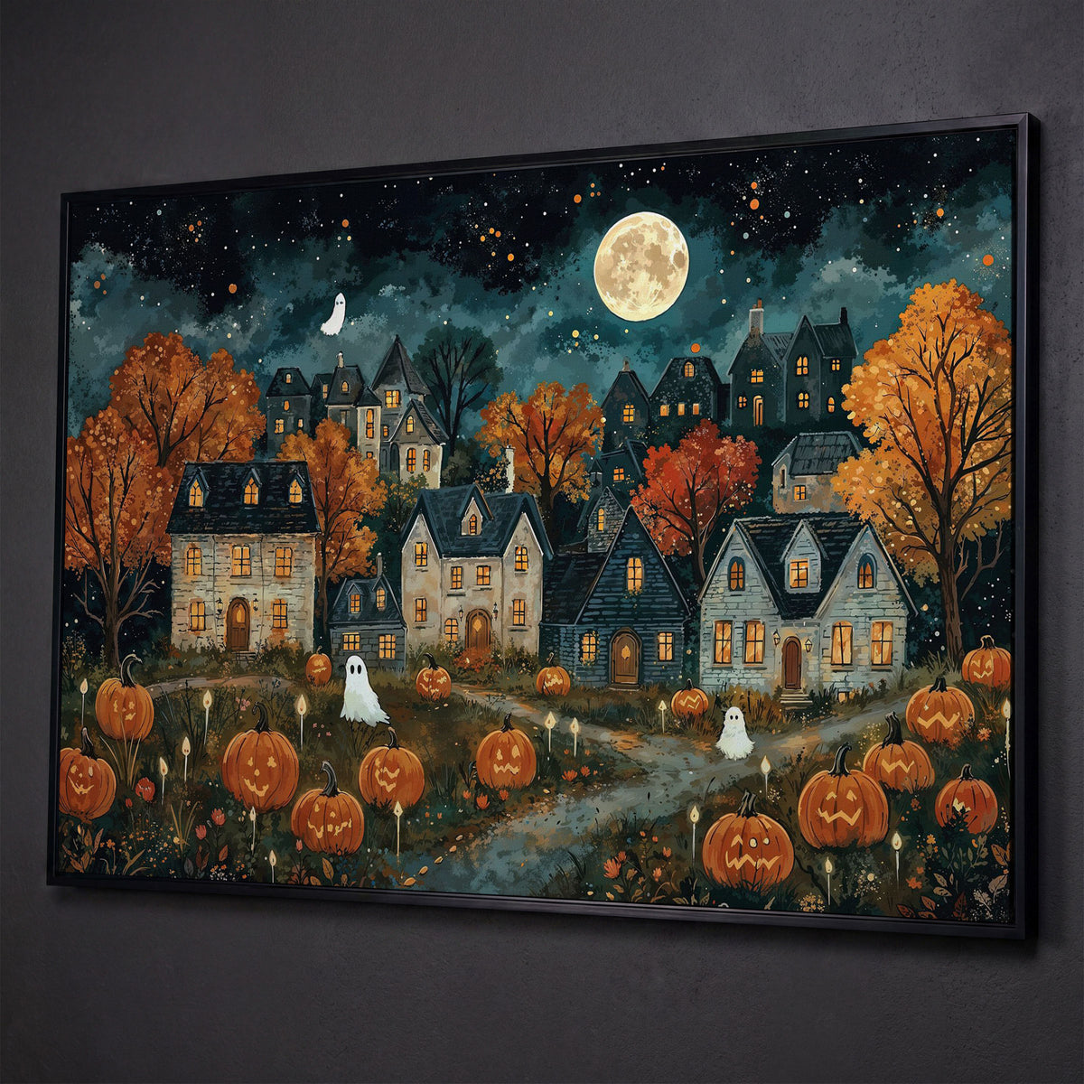 Haunted Village with Pumpkins Canvas shown in black floating frame