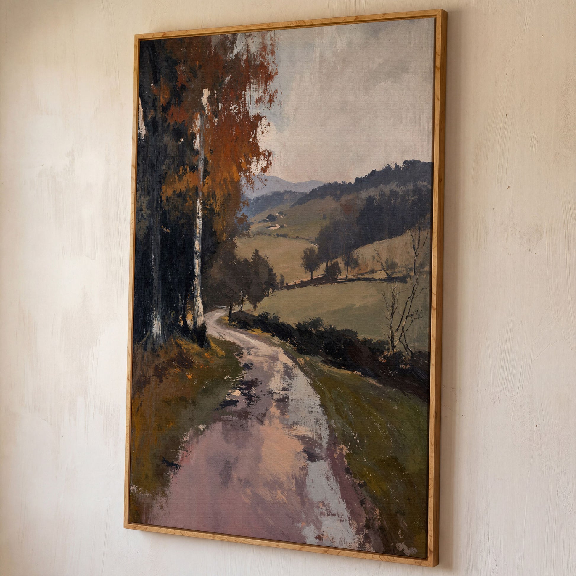 Winding Autumn Road Through Rolling Hills Canvas Wall Art shown in white oak floating frame
