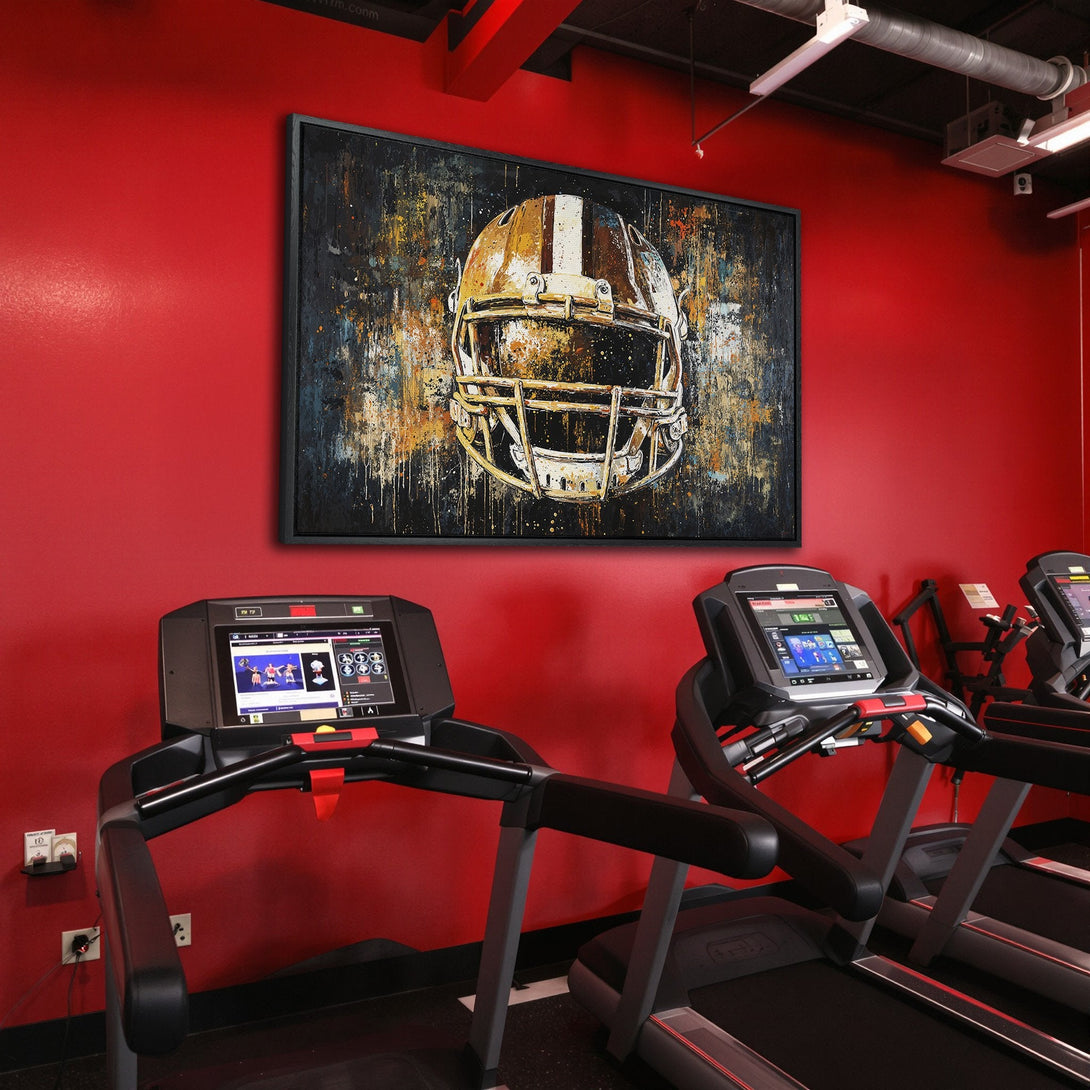 Framed Wall Art: Abstract football helmet in gold & black, displayed in a modern gym. Bold color palette adds a stylish touch to any space.